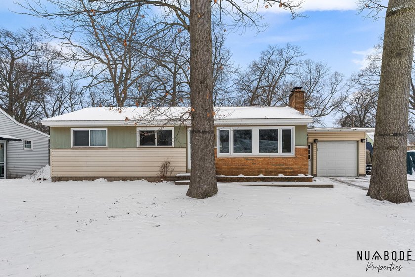Welcome to this charming brick ranch, perfectly nestled in a - Beach Home for sale in Norton Shores, Michigan on Beachhouse.com