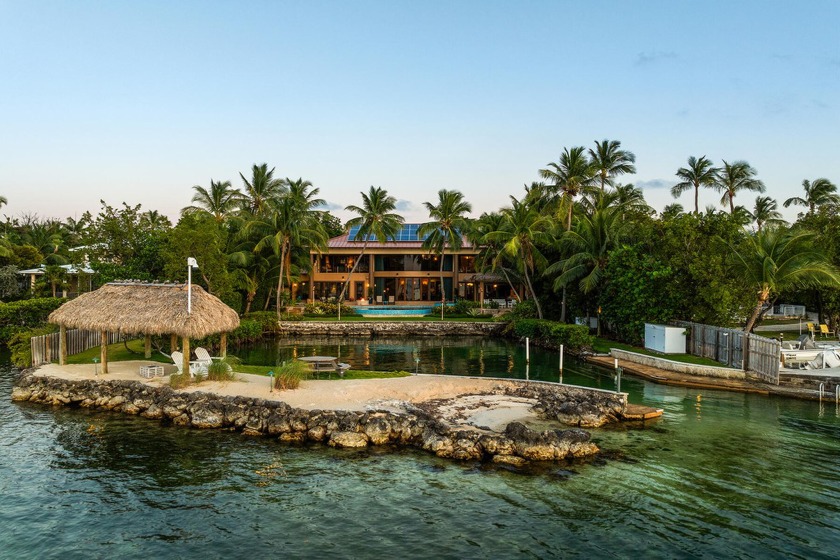 This exquisite bayfront Islamorada property features a main home - Beach Home for sale in Upper Matecumbe Key, Florida on Beachhouse.com