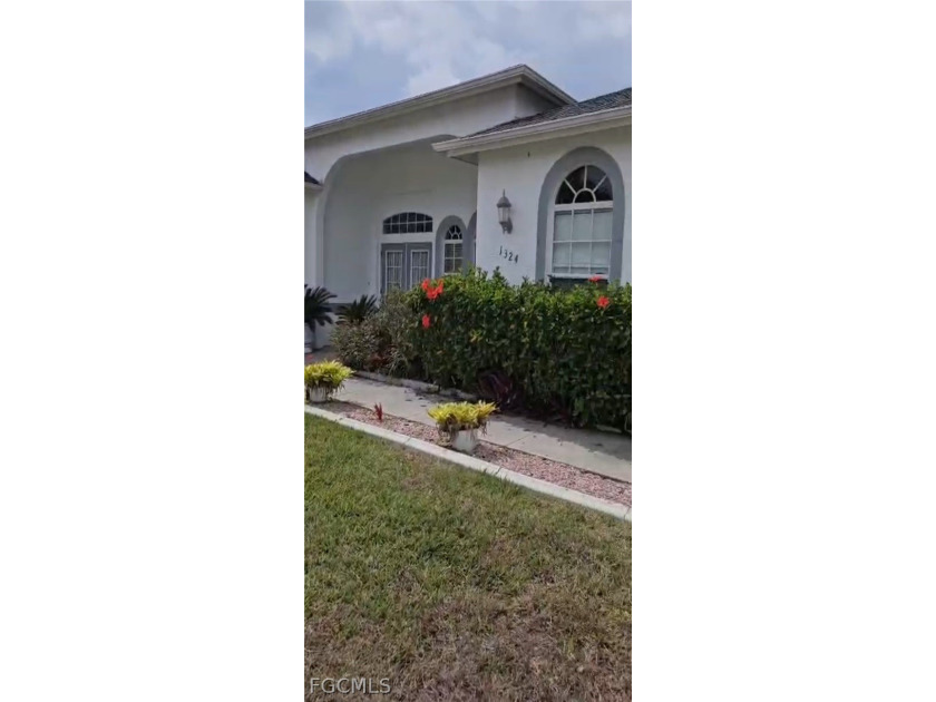 Set on an expansive triple-lot homesite of over 1/3 acre, this - Beach Home for sale in Cape Coral, Florida on Beachhouse.com