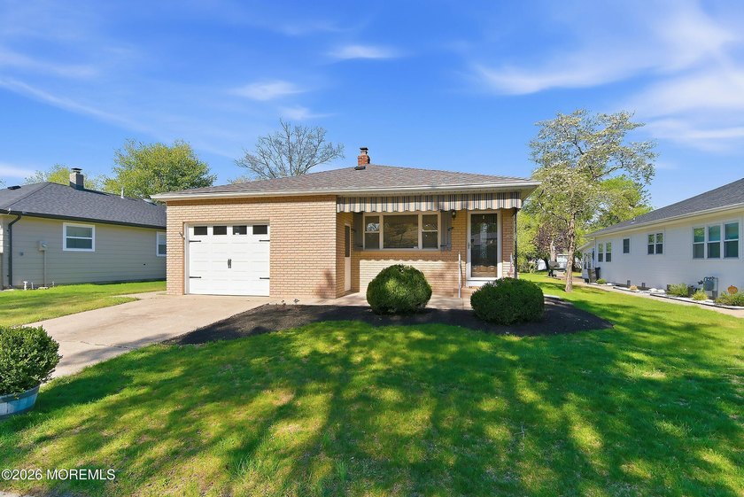 Enter this beautiful Lakeview model home from the covered front - Beach Home for sale in Toms River, New Jersey on Beachhouse.com