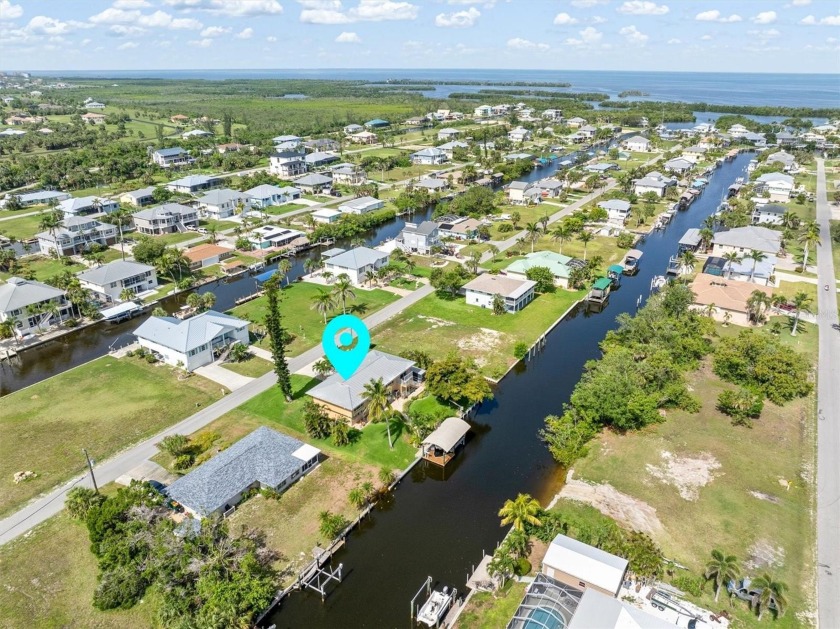 Welcome home to this elevated home in Pirate Harbor, a - Beach Home for sale in Punta Gorda, Florida on Beachhouse.com