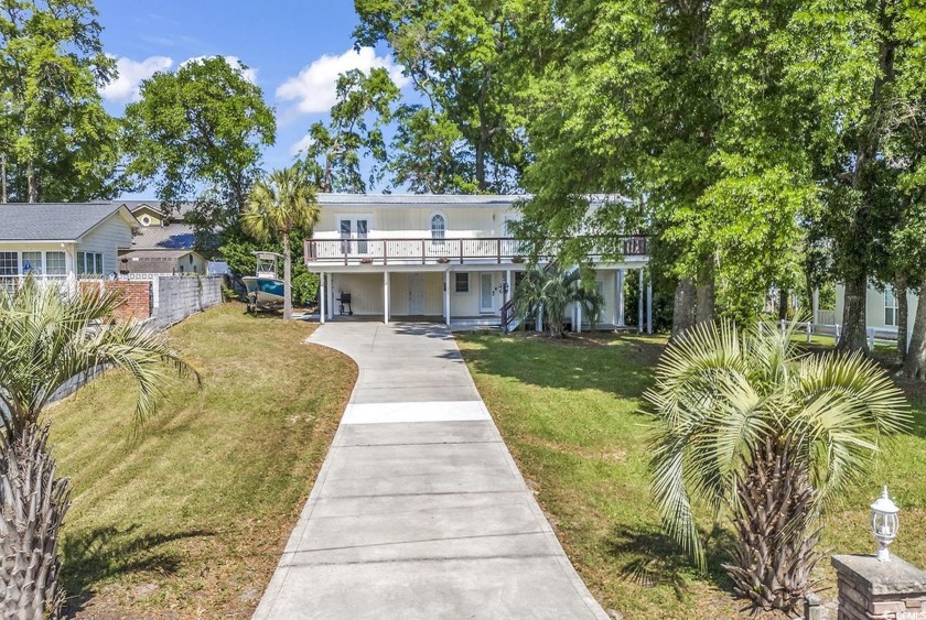 Nestled in the heart of Cherry Grove Beach, this charming home - Beach Home for sale in North Myrtle Beach, South Carolina on Beachhouse.com
