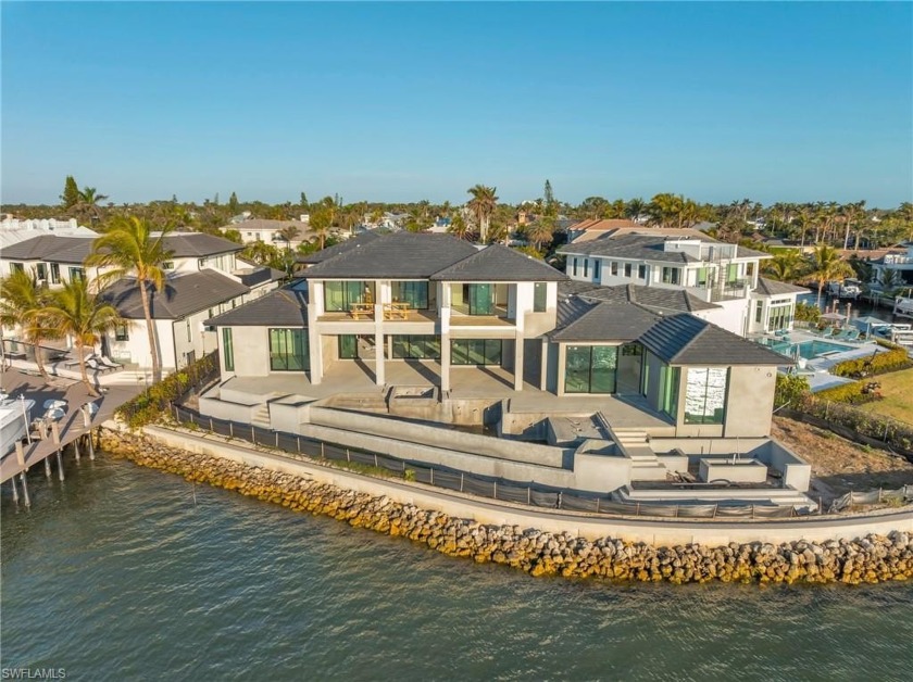 Step into the pinnacle of luxury waterfront living i with this - Beach Home for sale in Naples, Florida on Beachhouse.com
