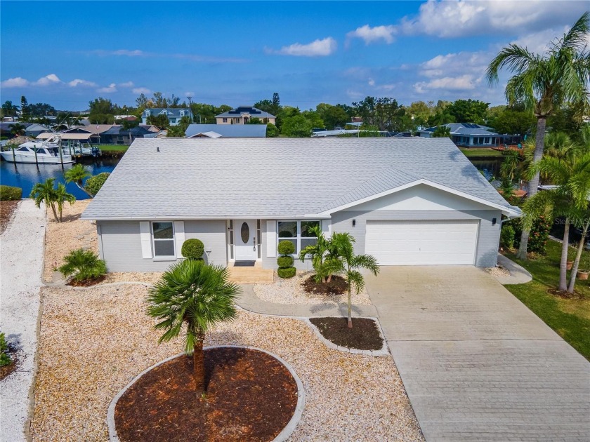 Don't miss this AMAZING COMPLETELY REMOVATED WATERFRONT HOME in - Beach Home for sale in Ruskin, Florida on Beachhouse.com