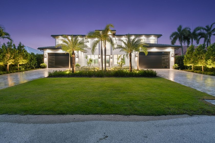 Set along a wide, deep-water canal, 2408 Azure Circle offers an - Beach Home for sale in Palm Beach Gardens, Florida on Beachhouse.com