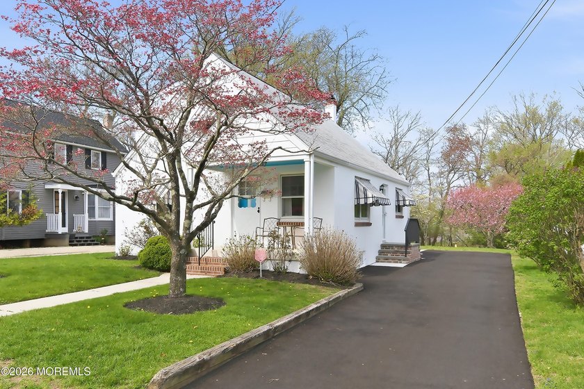 LOCATION, LOCATION, LOCATION! Set on a generous oversized lot - Beach Home for sale in Manasquan, New Jersey on Beachhouse.com