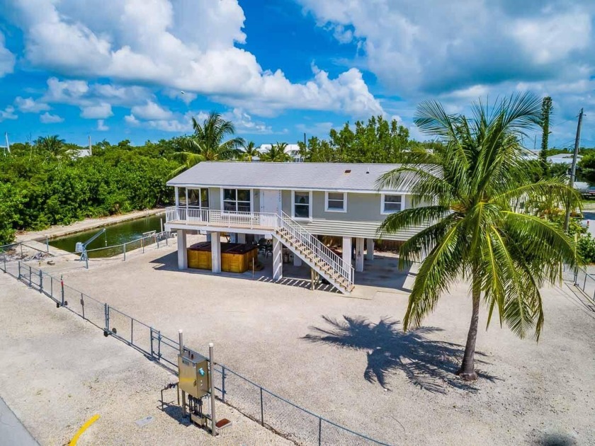 Idyllic Canal-Front Cudjoe Key retreat on a generous fenced-in - Beach Home for sale in Cudjoe Key, Florida on Beachhouse.com