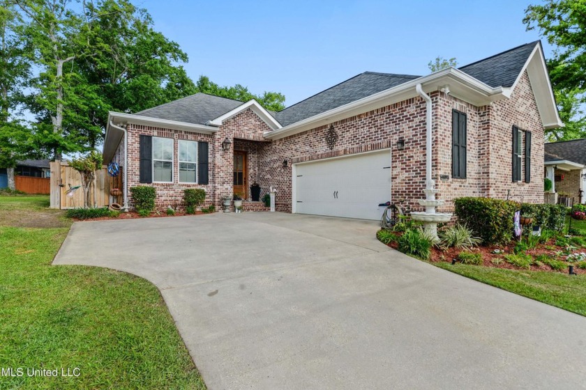 Welcome to this stunning 3-bedroom, 2.5-bath home that perfectly - Beach Home for sale in Gulfport, Mississippi on Beachhouse.com