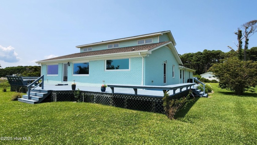 Welcome to your waterfront retreat! This three bedroom, two and - Beach Home for sale in Gloucester, North Carolina on Beachhouse.com