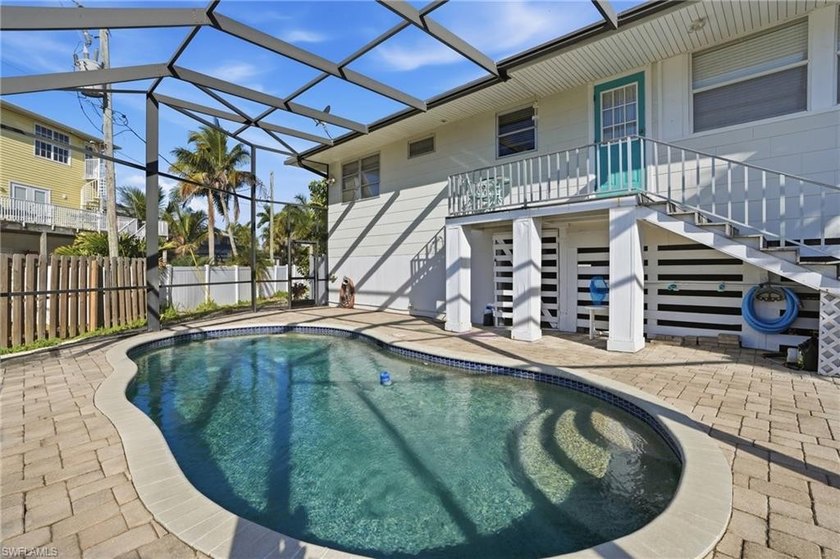 Tucked away on a quiet, private road, this elevated Fort Myers - Beach Home for sale in Fort Myers Beach, Florida on Beachhouse.com