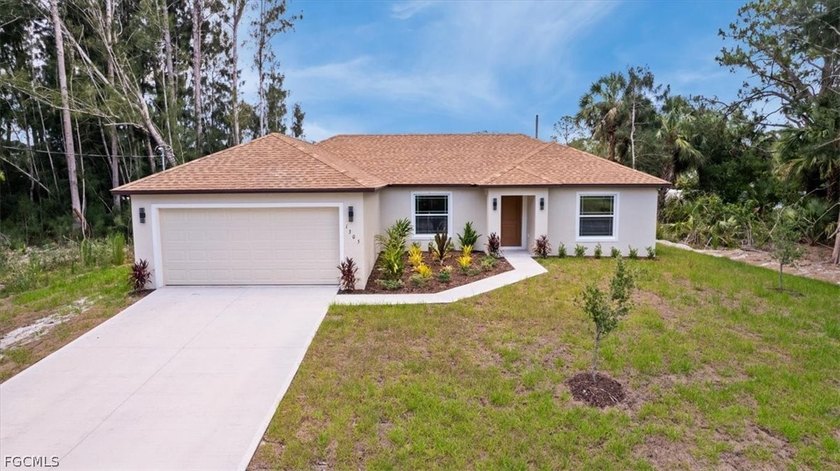 This beautifully crafted new construction home offers a modern - Beach Home for sale in Lehigh Acres, Florida on Beachhouse.com