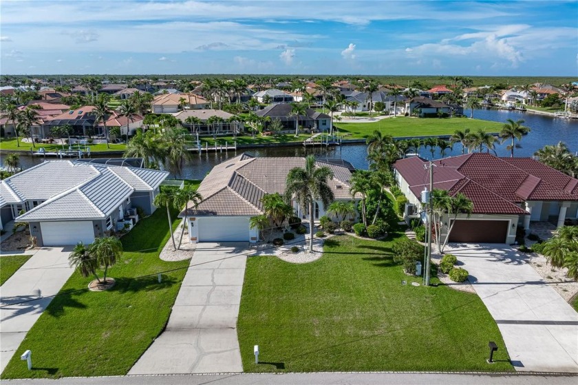 WATERFRONT GEM IN BURNT STORE ISLES - MOVE-IN READY W/SAIL - Beach Home for sale in Punta Gorda, Florida on Beachhouse.com