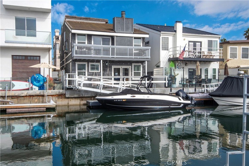 This stunning three-level waterfront home on Sunset Island - Beach Home for sale in Huntington Beach, California on Beachhouse.com