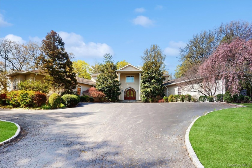 Tucked away on a serene private road just minutes from the - Beach Home for sale in Locust Valley, New York on Beachhouse.com