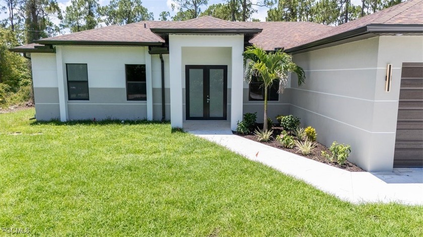 This inviting 3-bedroom home with a versatile den offers the - Beach Home for sale in Lehigh Acres, Florida on Beachhouse.com