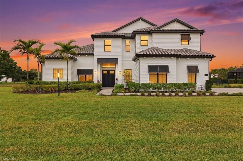 Set on nearly one acre with western lake views, this exceptional - Beach Home for sale in Estero, Florida on Beachhouse.com