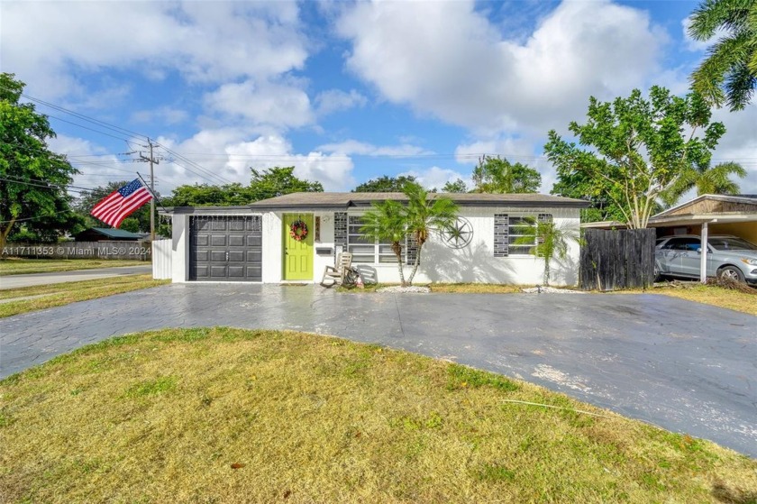 Situated on a spacious corner lot in a quiet neighborhood, this - Beach Home for sale in Hollywood, Florida on Beachhouse.com