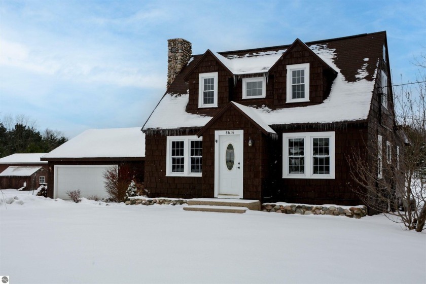 Discover an enchanting vintage Cape Cod style farmhouse nestled - Beach Home for sale in Traverse City, Michigan on Beachhouse.com