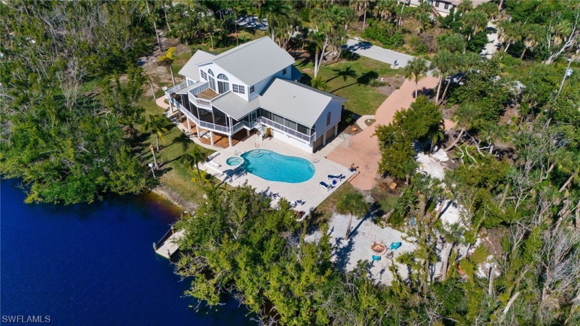 Beautiful open water views of Dinkins Lake from this 3 BR, 3.5 - Beach Home for sale in Sanibel, Florida on Beachhouse.com