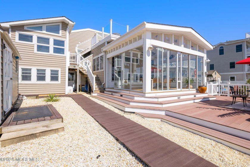 This bayfront beauty is a contemporary three-level split home - Beach Home for sale in Little Egg Harbor, New Jersey on Beachhouse.com