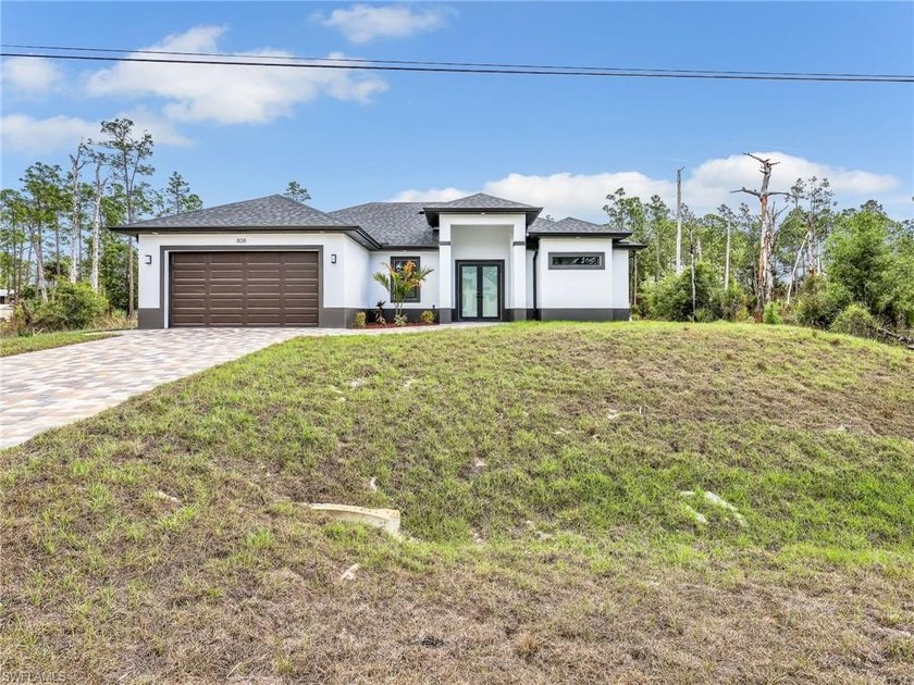 The most stunning NEW CONSTRUCTION on a HALF-ACRE LOT in Lehigh - Beach Home for sale in Lehigh Acres, Florida on Beachhouse.com