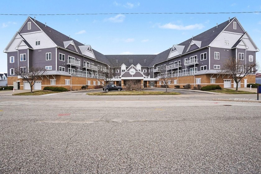 Welcome to affordable lakefront living in this beautiful ground - Beach Condo for sale in Spring Lake, Michigan on Beachhouse.com