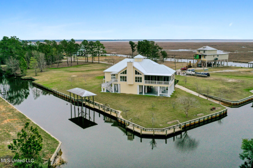 STUNNING HOME W/ 240 FT OF WATERFRONT FOOTAGE. BULKHEAD (240 ft) - Beach Home for sale in Diamondhead, Mississippi on Beachhouse.com