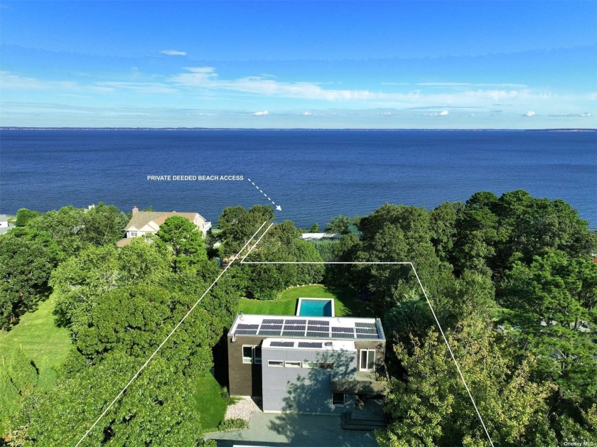 Nestled along the sun-kissed shores of the Hamptons, this - Beach Home for sale in Hampton Bays, New York on Beachhouse.com