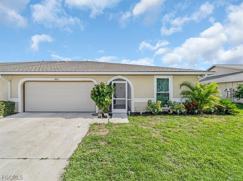 Step into the inviting warmth of this charming 2-bedroom plus - Beach Home for sale in Lehigh Acres, Florida on Beachhouse.com