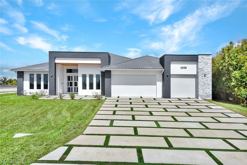 Experience elevated waterfront living in this stunning new - Beach Home for sale in Cape Coral, Florida on Beachhouse.com