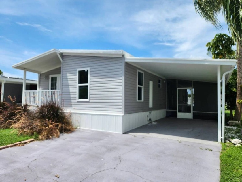 This 3 bed 2 bath waterfront home is located in Winward Lakes a - Beach Home for sale in Tampa, Florida on Beachhouse.com