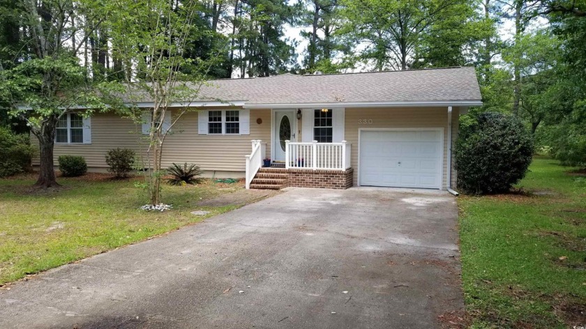 Welcome to this charming home on a large lot, bordered in the - Beach Home for sale in Pawleys Island, South Carolina on Beachhouse.com