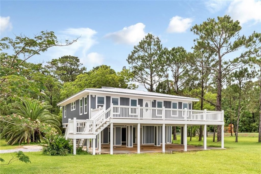 Beautiful waterfront views of Mobile Bay! This house is - Beach Home for sale in Coden, Alabama on Beachhouse.com