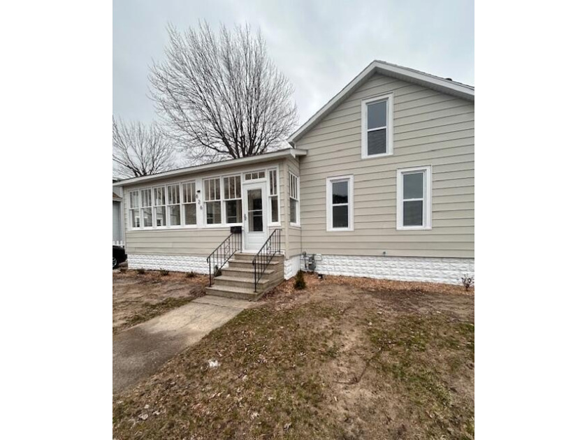 Welcome to 826 Elliott! This beautifully remodeled two-story - Beach Home for sale in Grand Haven, Michigan on Beachhouse.com