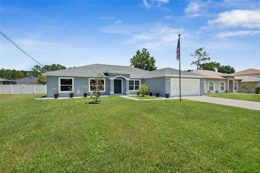 TURN KEY MOVE IN READY! Welcome to this spacious and - Beach Home for sale in Palm Coast, Florida on Beachhouse.com