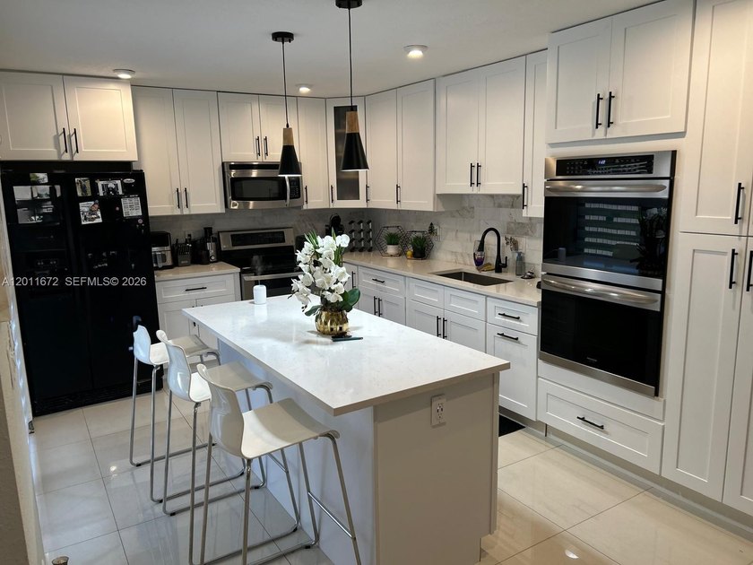 Beautifully kept two-story, 3-bedroom, 2.5-bathroom home in - Beach Townhome/Townhouse for sale in Tamarac, Florida on Beachhouse.com
