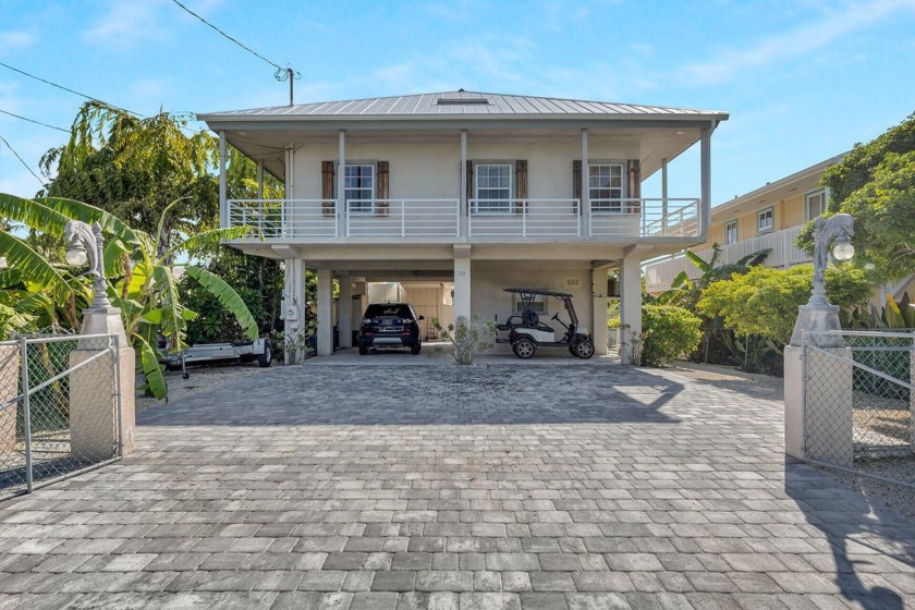 Introducing a first-time-ever listed canal front home in the - Beach Home for sale in Long Key, Florida on Beachhouse.com