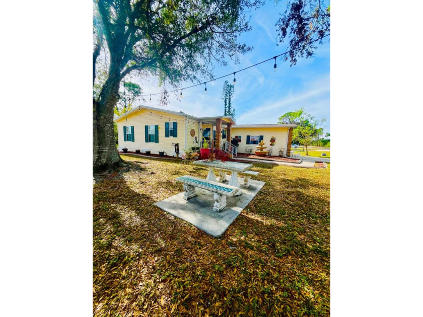 This charming two-bedroom, two-bathroom home is nestled in a - Beach Home for sale in North Fort Myers, Florida on Beachhouse.com