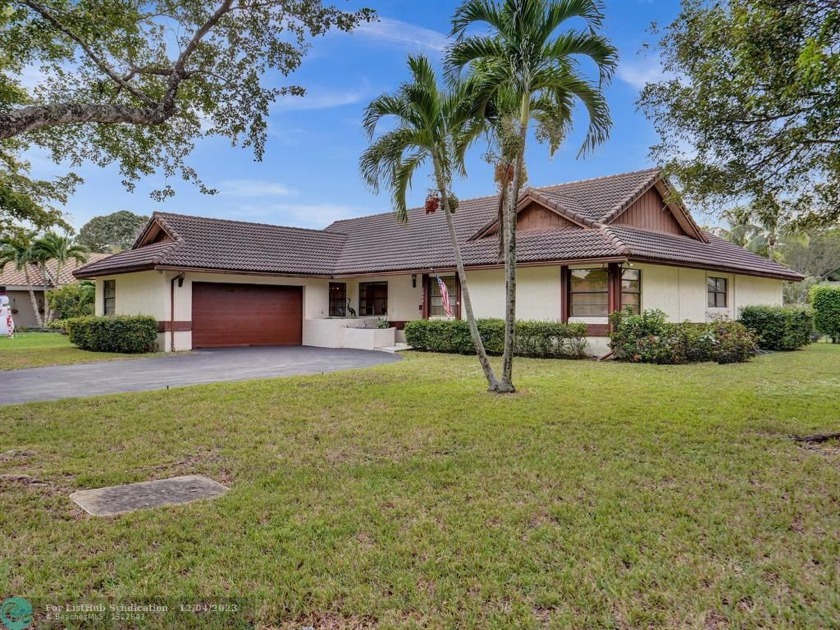Great Single family house sitting on a canal located in the - Beach Home for sale in Coral Springs, Florida on Beachhouse.com