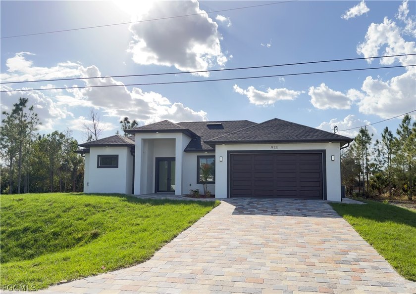 **New Construction on Half-Acre Lot!** This stunning 3-bedroom - Beach Home for sale in Lehigh Acres, Florida on Beachhouse.com