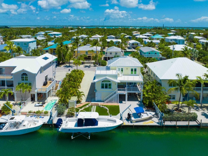 Stunning Summerland Cove Isles retreat, situated on a - Beach Home for sale in Summerland Key, Florida on Beachhouse.com