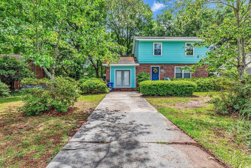 LOCATION is everything!  This spacious, four bedroom, two and a - Beach Home for sale in Surfside Beach, South Carolina on Beachhouse.com