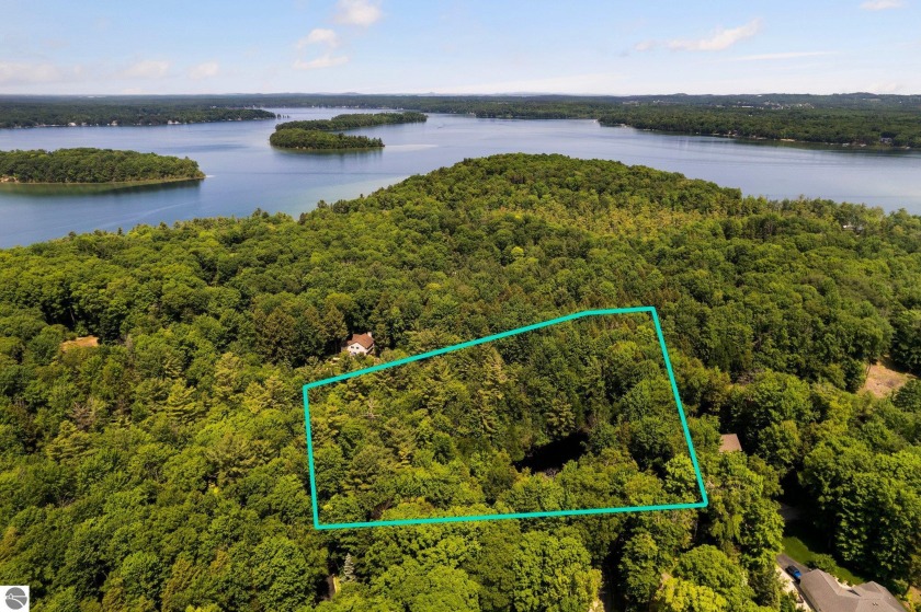 Comprised of 4 adjacent lots, this lushly wooded 2.7-acre parcel - Beach Acreage for sale in Traverse City, Michigan on Beachhouse.com