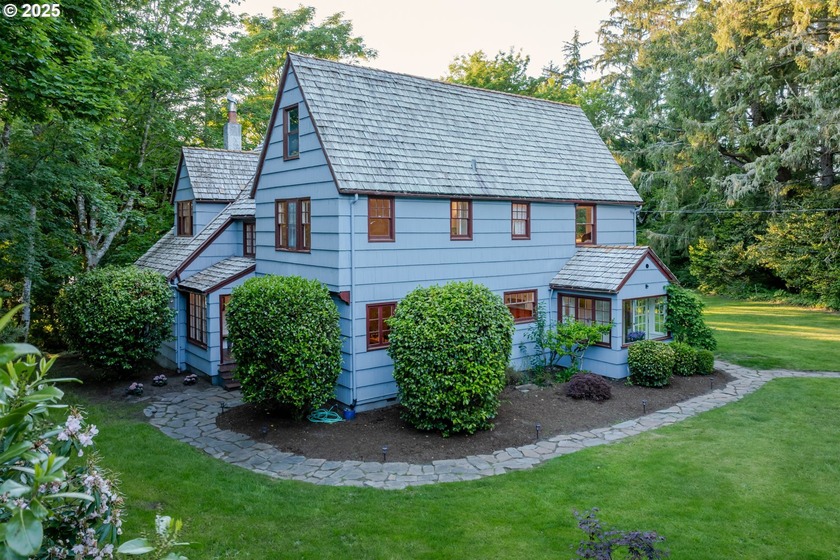 Step into a fairytale estate on 1.62 lakefront acres. This - Beach Home for sale in Warrenton, Oregon on Beachhouse.com