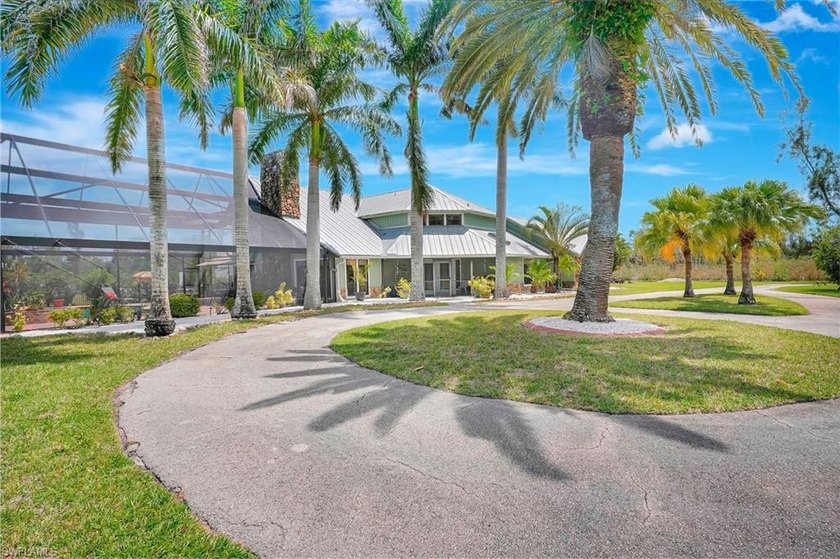 Nestled at the end of a private cul-de-sac, this stunning - Beach Home for sale in Fort Myers, Florida on Beachhouse.com