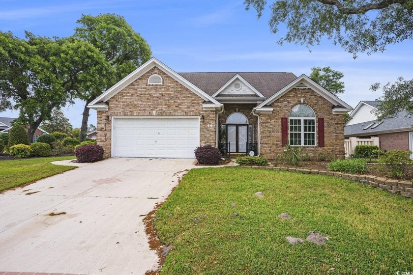 This beautifully maintained, all brick, 3-bedroom, 2-bath home - Beach Home for sale in Pawleys Island, South Carolina on Beachhouse.com