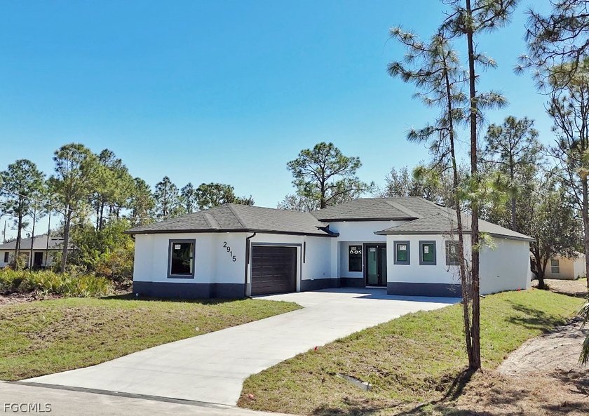 Welcome to this stunning new-build (2026) home on a spacious - Beach Home for sale in Lehigh Acres, Florida on Beachhouse.com