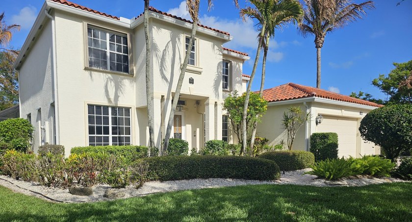 This two-story home is perfectly situated in a charming coastal - Beach Home for sale in Hobe Sound, Florida on Beachhouse.com