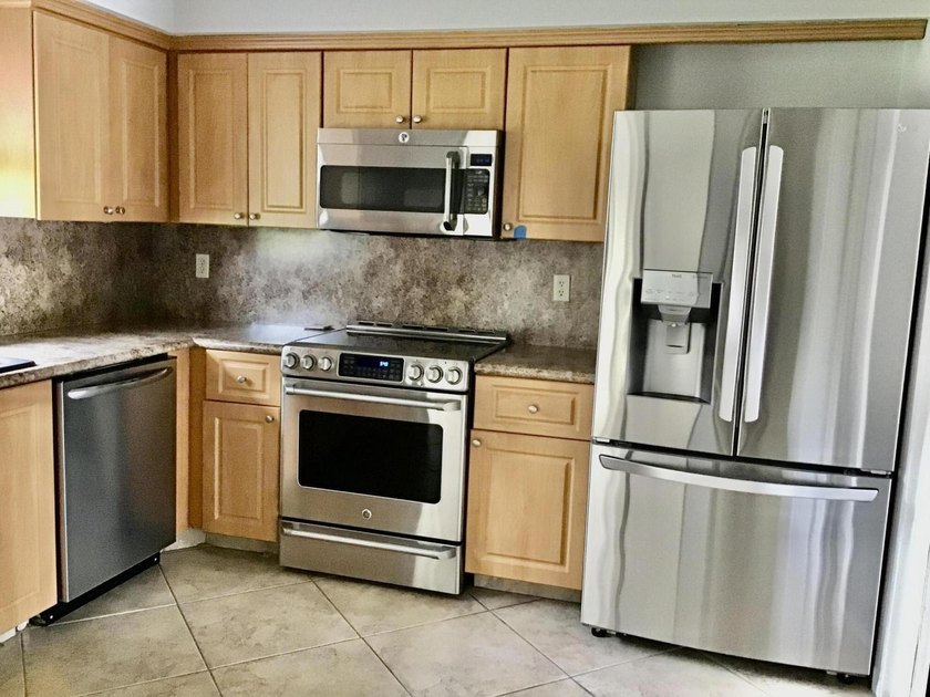 Tastefully updated Villa with extended driveway in private Cul - Beach Home for sale in Boynton Beach, Florida on Beachhouse.com