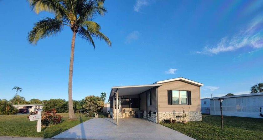 Welcome to Easy Florida Living!  Located in a desirable 55 and - Beach Home for sale in West Palm Beach, Florida on Beachhouse.com